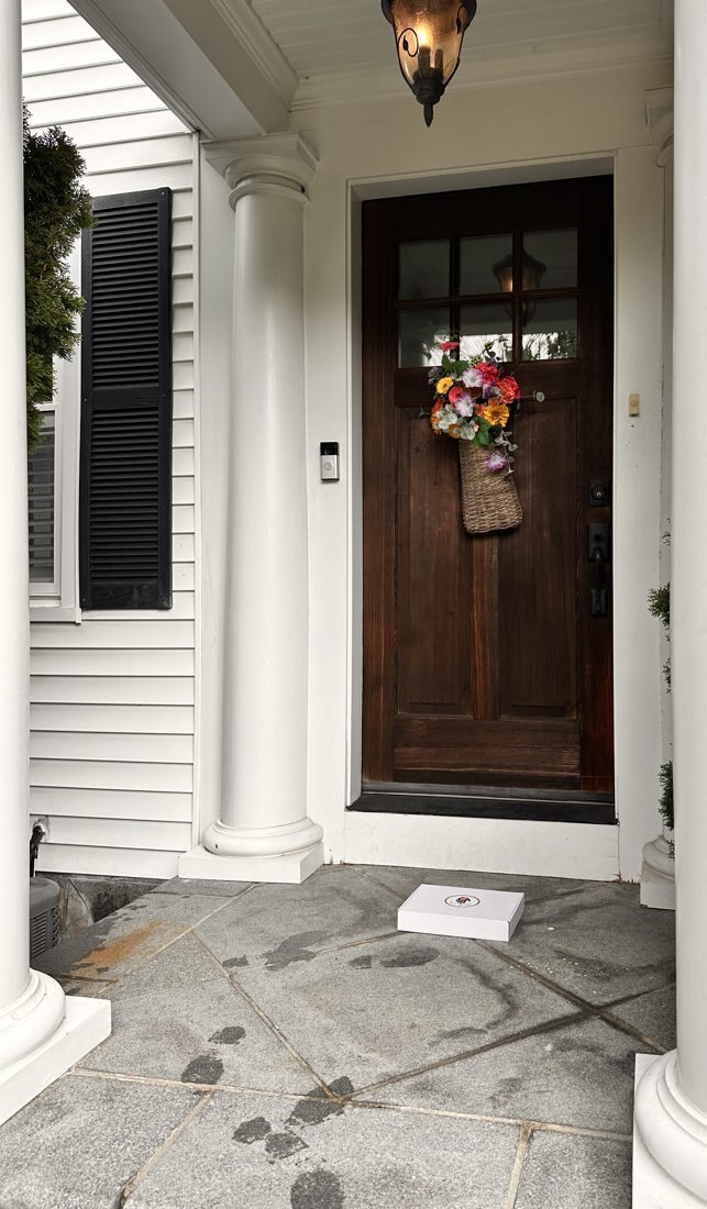 A delivered box on a front porch
